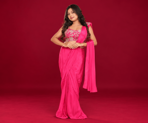 fuchsia saree against burgundy backdrop